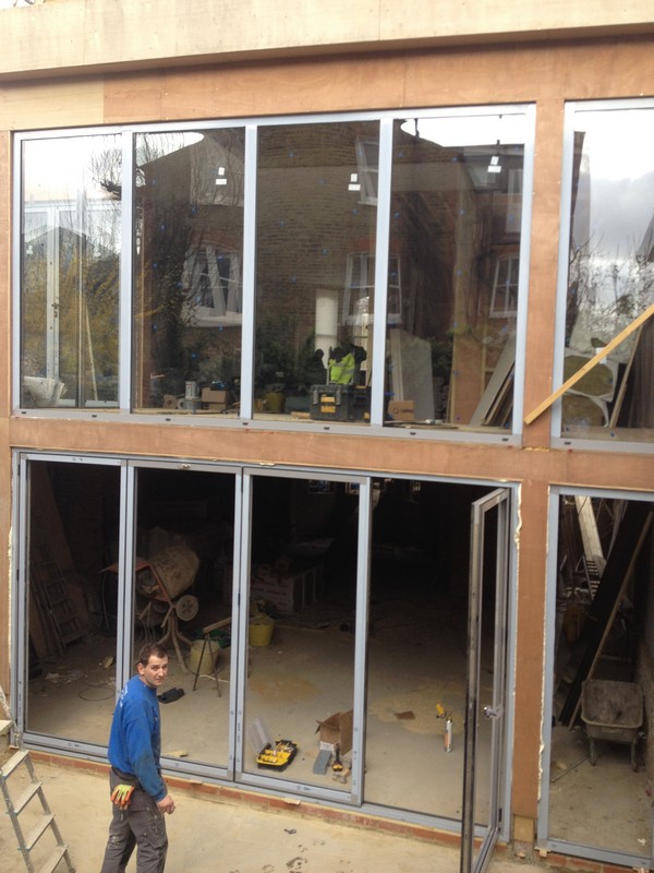 Aluminium bi-fold doors with two-storey glazing in Neasden
