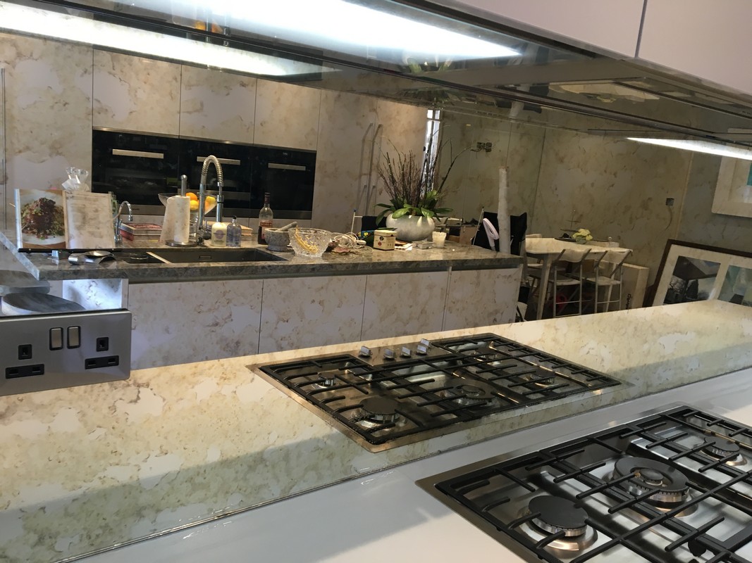 Mirror glass splashback in Neasden luxury kitchen